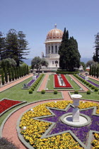 Zionism Avenue.  View of Bahai Shrine and Gardens built as a memorial to the founders of the Baha i faith.  Formal flower beds  paths and cypress trees with domed shrine.sanctuarypilgrimagesacredr...