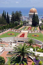Zionism Avenue.  View of Bahai Shrine and Gardens.  Formal layout of flowerbeds and pathways with domed shrine and cypress trees and sea beyond.sanctuarypilgimagesacredreligionmonothesistic faith...