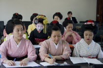 Gion District  the neighbourhood where Geisha live  study and perform.  Geisha and Maiko apprentice Geisha dressed in kimonos attending a class at Mia Garatso school of Geisha.Far EastGeikotraditio...