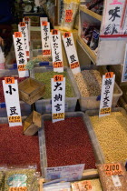 Tsukiji market.   Labelled boxes of seeds and pulses for sale at at the worlds biggest fish and food market known as  the stomach of Tokyo .Japanese labelKanji writingKangiKanghilettersscriptn...