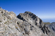 View of  highest peak of Mount Olympus called Mytikas.  Eroded rocks and scree against blue  cloudless sky.OlymposMitikasMytykasMitykasEllada European Greek Scenic Southern Europe