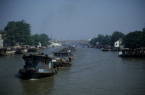 Barge train travelling down the Grand Canal between Suzhou and Wuxi. Asia Asian Chinese Chungkuo Jhonggu Zhonggu Traveling