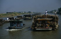 Barges travelling down the Grand Canal between Suzhou and Wuxi. Asia Asian Chinese Chungkuo Jhonggu� Zhonggu� Traveling