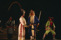 Chinese Opera with male and female performers dressed in costume on stagePeking Asia Asian Beijing Chungkuo Jhonggu Performance Zhonggu