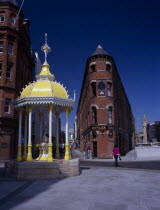 Victoria Square.  Jaffe Fountain and brick exterior facade of Bittles Bar with the Albert Memorial Clock Tower in the background.Bal Feirste Eire European Inn Irish Northern Europe Pub Republic Tave...
