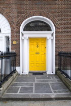 Georgian doorway near Merrion Square with yellow doorIreland Eire Dublin Georgian Architecture Doorways