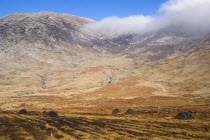 Maumturk Mountains with turf stacks  Ireland Eire Landscapes Energy Peat Bogs Mountains