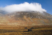 Maumturk Mountains with turf stacks  Ireland Eire Landscapes Energy Peat Bogs Mountains