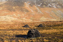 Maumturk Mountains with turf stacks  Ireland Eire Landscapes Energy Peat Bogs Mountains