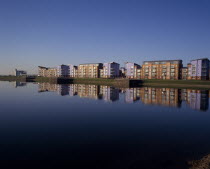 Millennium Quay dockside apartments development with the buildings reflected on water.South WalesEuropean Scenic Cymru Great Britain Northern Europe UK United Kingdom