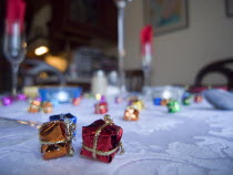 Minature wrapped Christmas presents used as festive dinner table decorations.Cultural Cultures European Order Fellowship Guild Club Religion Religious Xmas