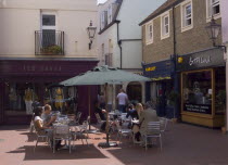 People sat at tables outside cafe in Dukes Lane.European Great Britain Northern Europe UK United Kingdom British Isles Bar Bistro Holidaymakers Restaurant Tourism Tourist Inn Pub Sightseeing Tavern T...