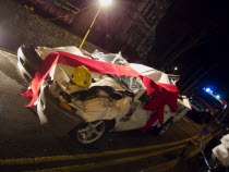 Wrecked car wrapped in red bow as part of a police anti Drink Drive campaign for the Christmas period.European Great Britain Northern Europe UK United Kingdom British Isles Automobile Automobiles Aut...