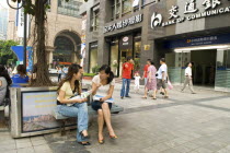 Shoppers chatting in downtown. Chongqing is Chinas largest cityAsia Asian Chinese Chungkuo Jhonggu Zhonggu Kids