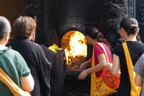 Puji Temple outer courtyard. Burning incense packaging material and other garbageAsia Asian Chinese Chungkuo Jhonggu Zhonggu Religious