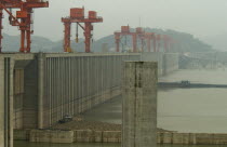 The Three Gorges Dam at Sandouping - the scale can be seen from the beached barge in the foregroundAsia Asian Chinese Chungkuo Jhonggu Zhonggu 3