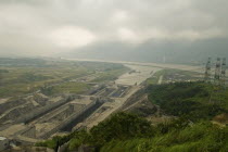 Hydro-electric pylons and the east bound locks at the Three Gorges Dam project on the Yangtze River at Sandouping. Power generation increased river trade and flood control are the main objectives of t...