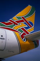 Boeing 737 at Gatwick Airport operated by British Airways. Detail of tail design by artist Tim O Neil from Dublin Ireland entitled Colum meaning Dove in IrishEuropean Baile tha Cliath Eire Northern...