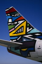 Boeing 737 at Gatwick Airport operated by British Airways. Detail of tail design by artists Emmly and Martha Masanabo from South Africa entitled NdebeleEuropean African
