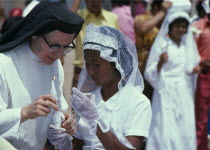 Roman Catholic Confirmation Cermony taking place in Barrio Indio Guayas slum neighbourhood.American Christian Equador Hispanic Kids Latin America Latino Neighbourhood District Religious shanty South...