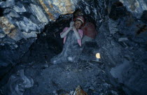 Tin miner at work in mineAmerican Bolivian Hispanic Latin America Latino South America