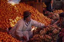 Woman selling oranges and bananas from her market stall American Bolivian Female Women Girl Lady Hispanic Kids Latin America Latino South America