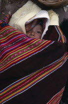 Aymara baby wrapped in local ponchoAmerican Babies Bolivian Hispanic Kids Latin America Latino South America