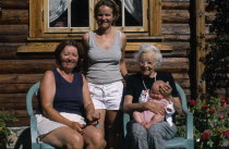 Group portrait of four generations of the Fossgard family including mother  grandmother and great grandmother holding new baby in Norway4 Babies European Grandma Granny Kids Mum Noreg Norge Northern...