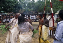 Punnaccolai Festival. Priest and woman in a state of trance watched by onlookersAsia Asian Female Women Girl Lady Llankai Religious Sri Lankan