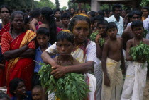 Punnaccolai Festival. Tamil Oracle named Sothimalarwith her arms wrapped around her son  both with ritual trident piercings inserted through cheeksAsia Asian Kids Llankai Religious Sri Lankan