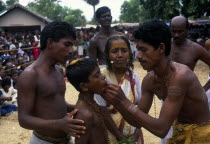 Punnaccolai Festival. Tamil Oracle named Sothimalarwith her son  both having ritual trident piercings inserted through cheeksAsia Asian Kids Llankai Religious Sri Lankan