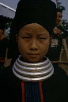 Head and shoulders portrait of a Meo girl wearing traditional dress and neck rings.Meo indigenous peopleAsian Classic Classical Historical Indegent Lao Older One individual Solo Lone Solitary Sout...