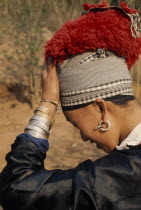 Young Meo bride wearing jewellery and an elaborate red head-dress in preparation for her weddingMeo indigenous peopleAsian Immature Indegent Jewelry Lao Marriage One individual Solo Lone Solitary...