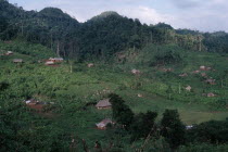 Q eqchi Indian refugee village. Thatched roof homes set amongst lush green vegetation and rainforest.Q eqchi indigenous people American Central America Hispanic Indegent Latin America Latino Scenic