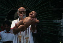 Padre Tiziano an Italian Roman Catholic missionary baptising a Q eqchi Indian babyAmerican Babies Central America Christian Hispanic Kids Latin America Latino Religious