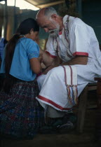 Padre Tiziano an Italian Roman Catholic missionary taking Confession with a Q eqchi Indian girl  American Central America Christian Hispanic Kids Latin America Latino Religious