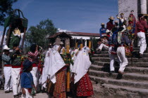 Quiche Indians carrying a statue of the Patron Saint in procession up the church steps during San Andres Festival on December  8th American Central America Hispanic Kids Latin America Latino Religiou...