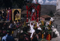 Quiche Indians knelling in prayer to the saints outside the 16th century church during San Andres Festival on December 8thAmerican Central America Hispanic Latin America Latino