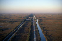 Aerial view over drainage canal and highwayNorth America United States of America American Motorway Scenic