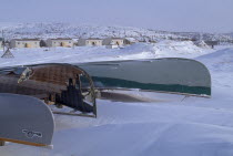 The Great Whale River Estuary in February with upturned canoes in deep snow. Cree indigeous communityGreat Whale River CreesAmerican Canadian North America