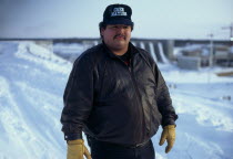 Man named Larry who is a Cree indigenous activist wearing a Cree Nation baseball cap standing in the snowGreat Whale River CreesAmerican Canadian Indegent Male Men Guy North America One individual...