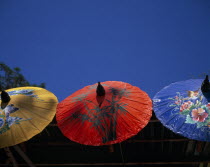 Bor Sang Umbrella and Sankampaeng Handicraft Festival.  Yellow  red and blue umbrellas painted with flowers  birds and bamboo. For more than 100 years Bor Sang village has been associated with the pr...