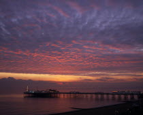 Early Autumn sunset from Marine Parade with Brighton Pier and street lights illuminated.season seasons light quiet Beaches Great Britain Northern Europe Resort Sand Sandy Seaside Shore Tourism UK Uni...
