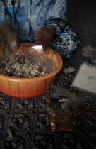 Trader bagging up frankincense for sale in souk.incensearomaticperfumegum resin Market Middle East Omani One individual Solo Lone Solitary 1 Single unitary