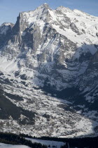 The town of Grindelwald spread out under Wetterhorn Mountain.European Schweiz Suisse Svizzera Swiss Western Europe  Winter Snow Mountains Scenic