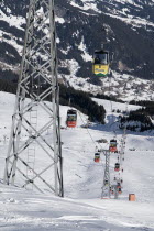 The Mannlichen Cable Car in motion as it rises from Grindelwald.European Schweiz Suisse Svizzera Swiss Western Europe  Transport Skiing MountainsAutomobile Automotive Cars Motorcar Scenic Winter Sp...