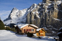 Snow covered houses in Murren with Eiger Mountain behindEuropean Schweiz Suisse Svizzera Swiss Western Europe  Winter Housing Architecture Snow Scenic