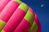 Section of Hot Air Balloon on ground as another balloon ascendsEuropean Schweiz Suisse Svizzera Swiss Western Europe  Hot Air Balloons Leisure Transport Guangzhou