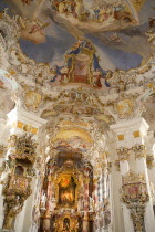 Baroque church  interior view of ornamentation and frescoes painted on ceiling above main altar and pulpit.Religion Architecture Churches RococoUNESCO World Heritage Site Bayern Deutschland Europea...