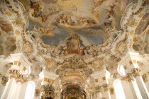 Baroque church  interior view of ornamentation and frescoes painted on celling above main altarReligion Architecture Churches RococoUNESCO World Heritage Site Bayern Deutschland European Religious...